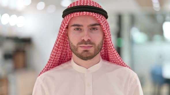 Portrait of Serious Arab Businessman Looking at Camera 