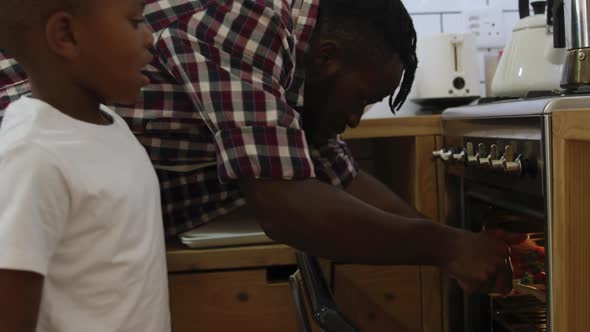 Father and son cooking together