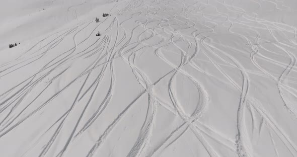 Aerial view Traces of skis on the snow mountain