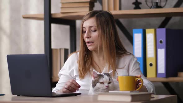 Portrait of Adult Woman Working Remotely at Home