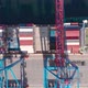 Drone Flying Over a Container Ship During Cargo Operations Over the Customs Area - VideoHive Item for Sale