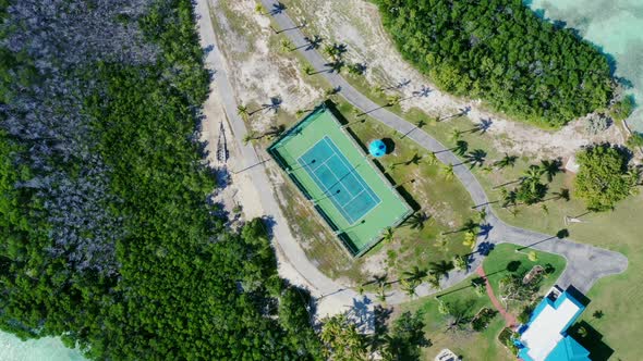 Tennis Court At Tea Table Key, Islamorada, Florida. - aerial overhead spinning