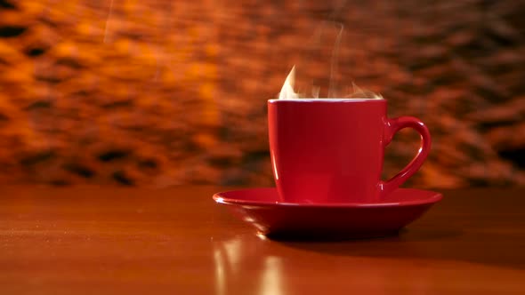 Cup of Coffee Is on the Table on a Red Saucer