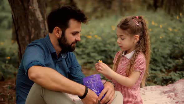 Father's Day. Daughter Kid With Father Eating Sweets. Daughter With Cheerful Father Eat Candy.