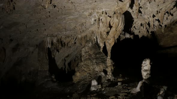 Slow tilt on  cave formations of stalactites 3840X2160 UltraHD tilting  footage - Natural decoration