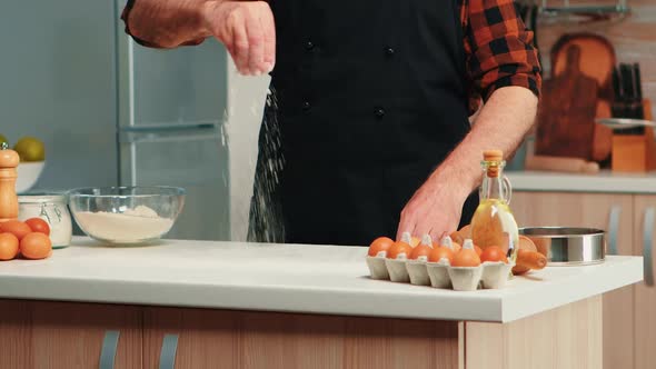 Mature Baker Using Flour