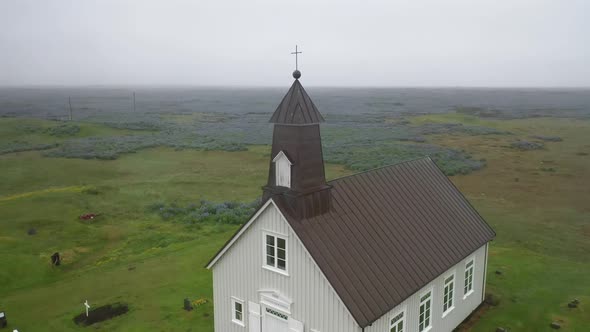 Strandarkirkj, the Church of Iceland with drone video pulling out.