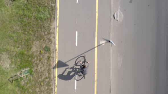 Bicycle ride on urban lane, cyclist riding a bike through city street
