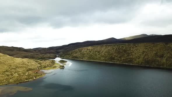 Incredible cinematic drone shot over a mountain range and lakes in South America