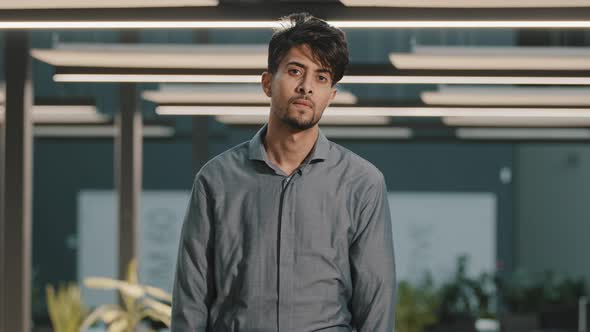 Portrait of Pensive Thoughtful Arab Man Businessman Boss Profile Looking Away Turns Head at Camera