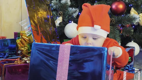 Toddler Receive Christmas Gifts