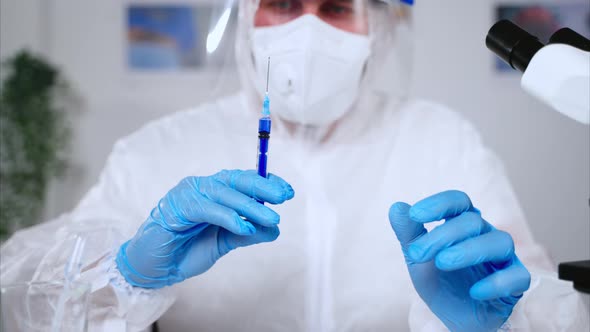 Medical Scientist with a Syringe