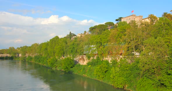 Tiber River In The Center Of Rome In Italy - panning shot