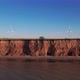 Windmills on a cliff above the sea, top view. Wind farm for wind energy. - VideoHive Item for Sale