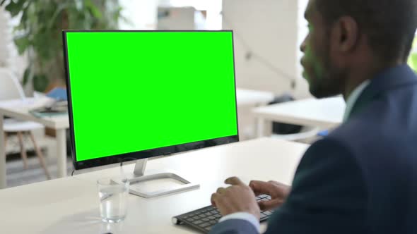 Businessman Using Desktop with Green Chroma Key Screen