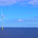 Windmills generating green energy at the sea in 4K - VideoHive Item for Sale