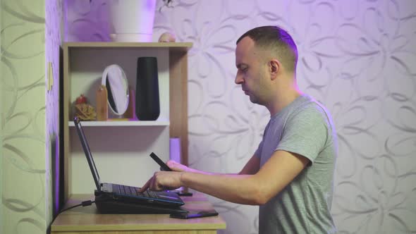 a Person Typing on a Laptop