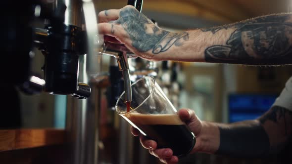 Barman Pouring Nitrogen Beer Into Glass Closeup