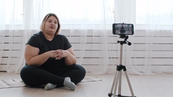 A Confident Overweight Woman Feminist Talking on a Video for Her Followers About Body Positivity