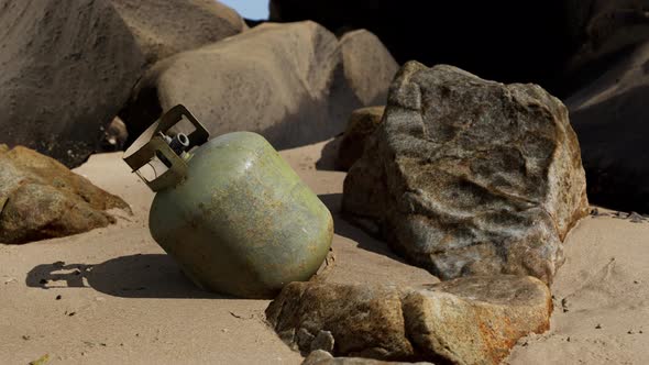 Old Cooking Gas Cylinder on Sand Beach