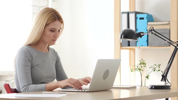 Woman Working on Laptop, Thinking and Planning