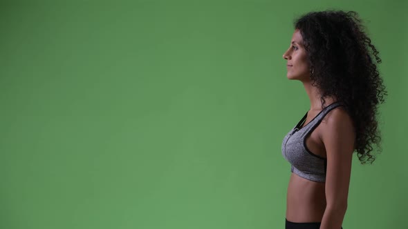 Profile View of Young Beautiful Hispanic Woman Ready for Gym