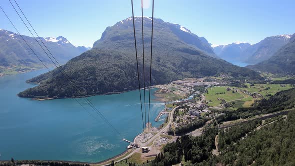 Traveling Loen Skylift gondola cabin - Magnificent panoramic view over Loen with mountains and glaci