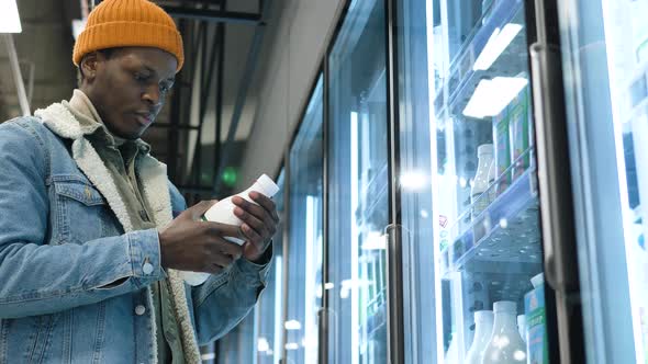 Serious Black Man in Denim Jacket Chooses Milk in Cool Case