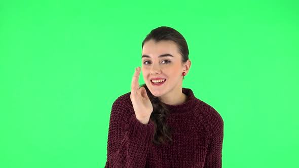 Girl Screams Calling Someone on a Green Screen at Studio. Green Screen