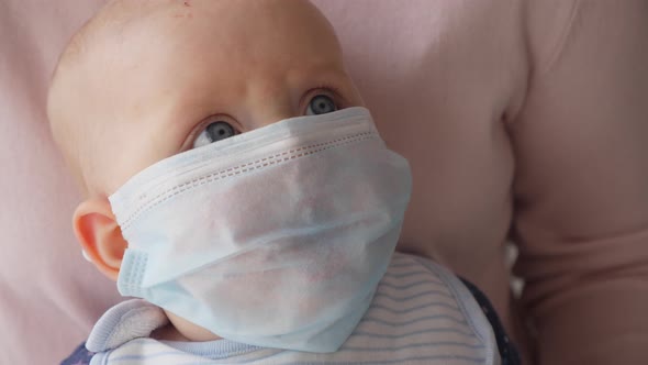 Crying Baby Wearing Protective Mask Against Virus.