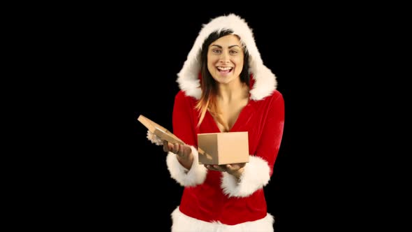 Sexy girl in santa costume opening a gift