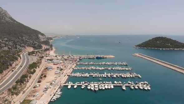 Ships, yachts and boats moored at sea marina port