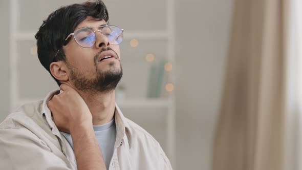 Portrait Young Tired Arabian Indian Student Business Man Bearded Guy with Glasses Sitting at Home in