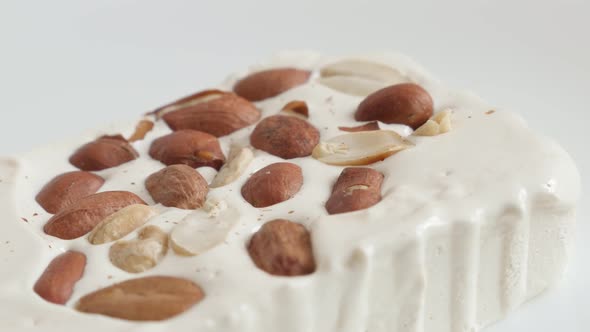 Slow pan over nougat halva with almonds 4K video