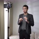 Asian man make a video call or conference with stand up and using smartphone - VideoHive Item for Sale