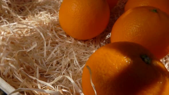 Panorama on Juicy Oranges Lie in a Wooden Box