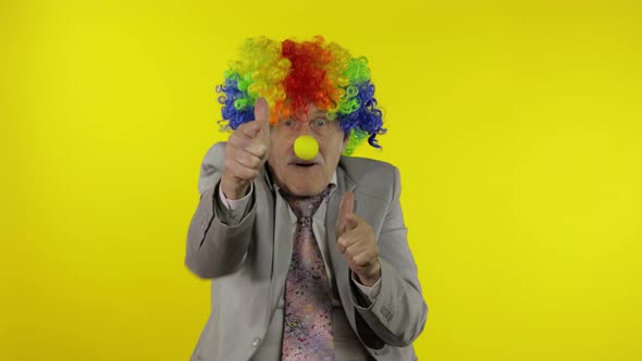 Elderly Clown Businessman Freelancer Boss Making Shot Signs From Hands
