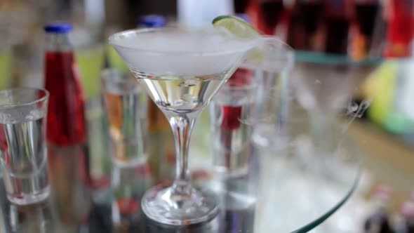 Smoking Martini Cocktail in a Conical Glass with Wafting Vapor