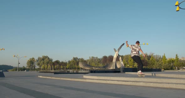 Impressive Skateboarding Tricks By a Young Man at the Park, 