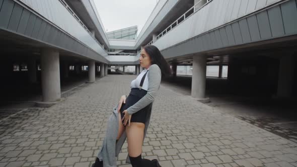 Dancing Woman Performs Modern Vogue Dance, Posing, Urban Contemporary Freestyle in Parking