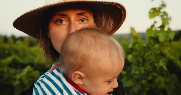 Portrait Happy Mother Gently Hugging Her Cute Little Baby Child in French Provence Vineyard During