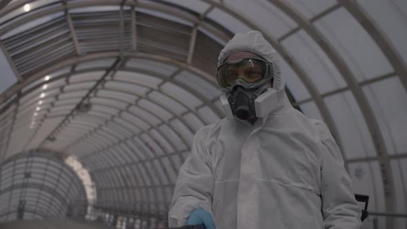 Man Sprays an Antibacterial Solution