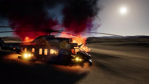Burned Military Helicopter in the Desert at Sunset alt