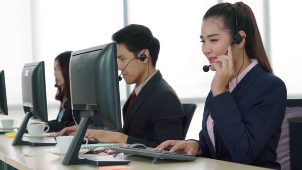 Business People Wearing Headset Working in Office