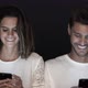 Couple laughing together while using smartphones - VideoHive Item for Sale