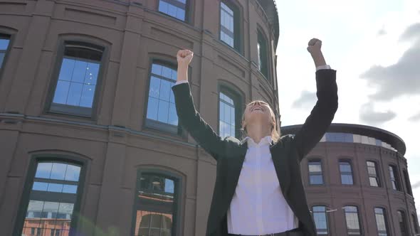 Winning Excited Businesswoman Celebrating Success of Results