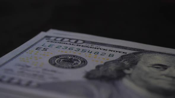 Slow motion of Counting dollar banknote money on table