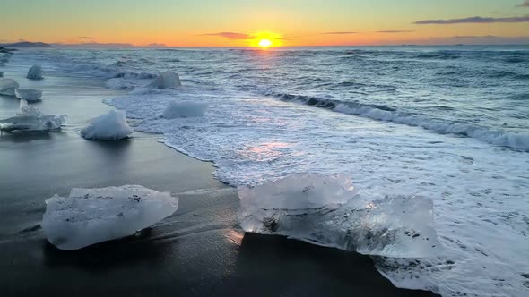 Ice From a Glacier Washing By Atlantic Ocean Waves on a Black Diamond Beach in Iceland. Global