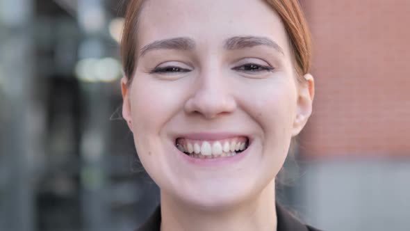 Close Up of Smiling Young Woman Face