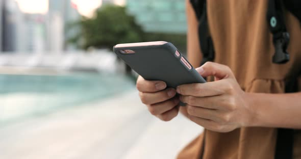 Woman using mobile phone in the park